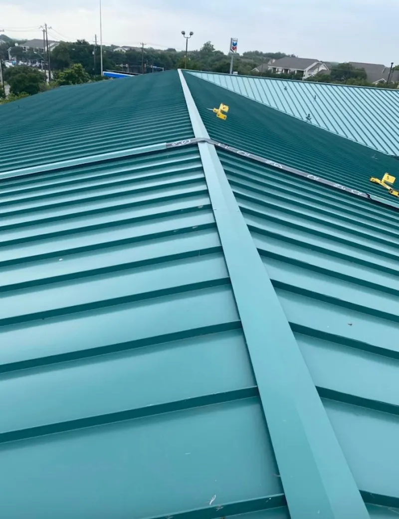 Green commercial metal roof ridge and valley for Metal Roof Repair in Exeter